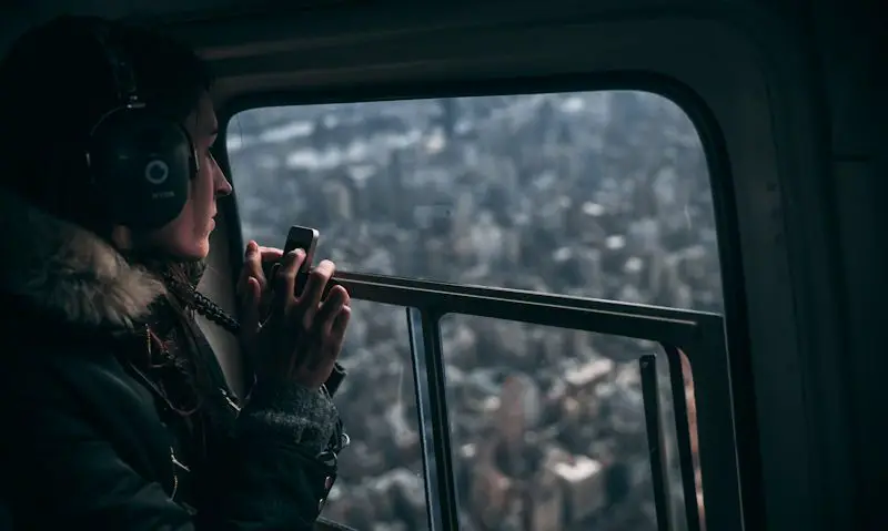 Female passenger gazing out of FlyNyon helicopter window