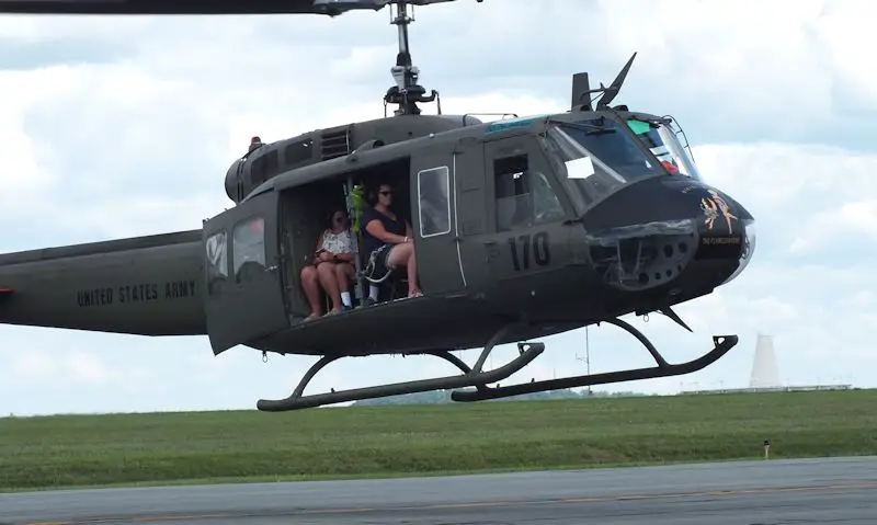 Passengers seen in Huey helicopter during flight