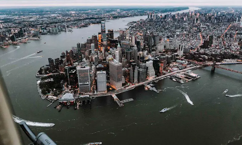 East River view of downtown Manhattan seen out of open door helicopter