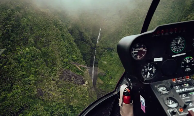 Oahu's Sacred Falls as seen from Robinson R44 cockpit