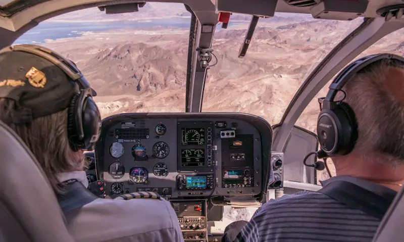 Pilot, passenger seen in cockpit overlooking Grand Canyon